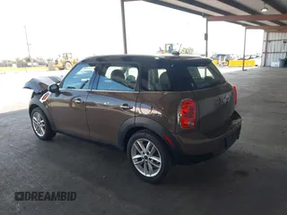 2012 MINI Countryman with VIN WMWZB3C51CWM04563, listed as a IAAI auction lot 42564564 with 95,760 mi miles and . Bid and sale history available at DreamBid. Image 3.