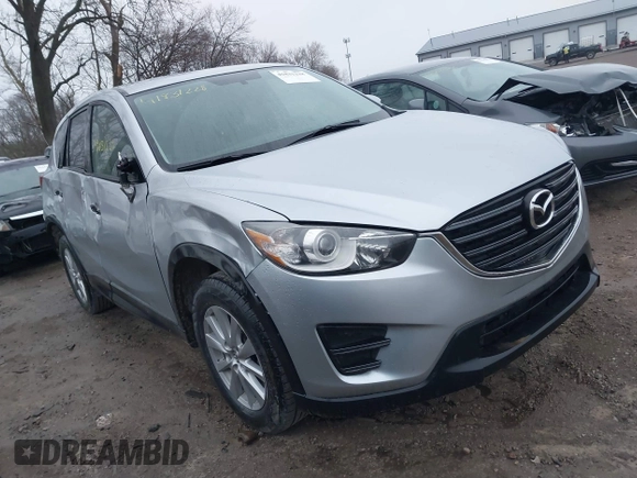 2016 Mazda CX-5 Sport with VIN JM3KE2BY5G0647715, listed as a IAAI auction lot 41831228 with 89,689 mi miles and . Bid and sale history available at DreamBid. Image 1.