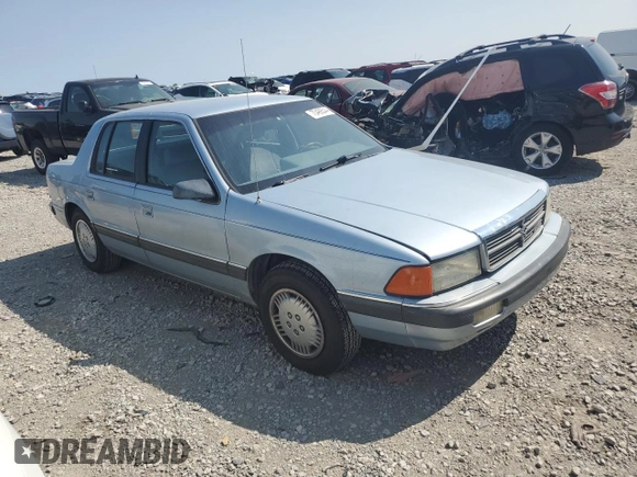 1989 Dodge Spirit z VIN 1B3BA46K1KF408949, wystawiony jako Copart lot #80767594 z przebiegiem 137 766 mil mil oraz Nie do naprawy. Historia ofert i sprzedaży dostępna na DreamBid. Obrazek 4.