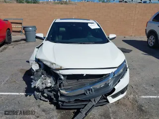 2017 Honda Civic Coupe Touring with VIN 2HGFC3B95HH356466, listed as a IAAI auction lot 41651157 with 100,940 mi miles. Bid and sale history available at carsss.com. Image 12.