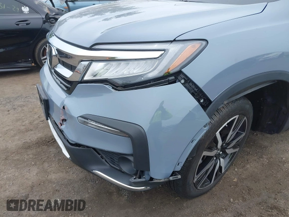 2022 Honda Pilot Touring 7-Passenger with VIN 5FNYF6H68NB056077, listed as a IAAI auction lot 42357338 with 18,193 mi miles and . Bid and sale history available at DreamBid. Image 6.