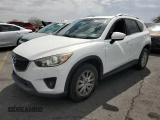 2014 Mazda CX-5 Touring z VIN JM3KE2CY3E0387276, wystawiony jako Copart lot #53564655 z przebiegiem 125 212 mil mil oraz Szkoda całkowita • Salvage title. Historia ofert i sprzedaży dostępna na DreamBid. Obrazek 1.