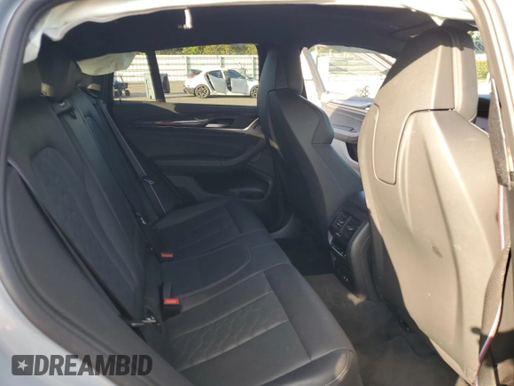 2022 BMW X4 M z VIN 5YM23EC00N9L35827, wystawiony jako Copart lot #87932635 z przebiegiem Nie podano mil oraz Szkoda całkowita • Salvage title. Historia ofert i sprzedaży dostępna na DreamBid. Obrazek 11.