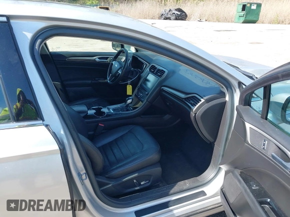 2016 Ford Fusion Energi SE Luxury with VIN 3FA6P0PU8GR273122, listed as a IAAI auction lot 42062083 with 166,318 mi miles. Bid and sale history available at carsss.com. Image 5.
