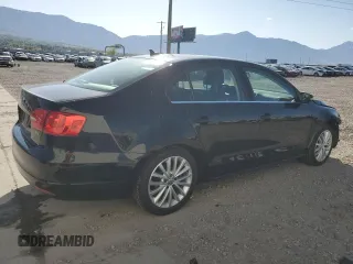 2014 Volkswagen Jetta TDI w/Premium with VIN 3VWLL7AJ2EM363857, listed as a Copart auction lot 54721665 with 134,225 mi miles and Salvage title. Bid and sale history available at DreamBid. Image 3.