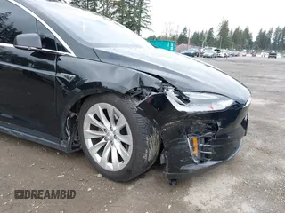 2016 Tesla Model X 70D with VIN 5YJXCBE20GF013046, listed as a IAAI auction lot 41944005 with 94,509 mi miles. Bid and sale history available at carsss.com. Image 6.