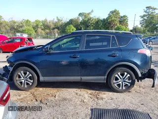 2018 Toyota RAV4 LE with VIN JTMZFREV1JJ203943, listed as a IAAI auction lot 41921863 with 104,691 mi miles. Bid and sale history available at carsss.com. Image 14.