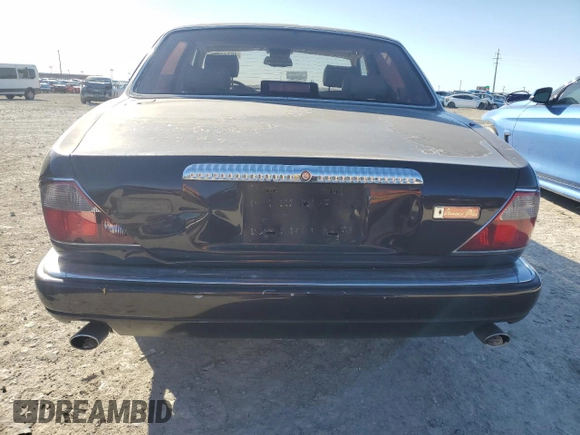 1995 Jaguar XJ with VIN SAJKX1743SC734007, listed as a Copart auction lot 46340825 with 130,115 mi miles and Salvage Title. Bid and sale history available at DreamBid. Image 6.