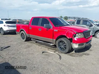 2005 Ford F-150 XLT with VIN 1FTPW12585KE04249, listed as a IAAI auction lot 41983950 with 212,289 mi miles. Bid and sale history available at carsss.com. Image 1.