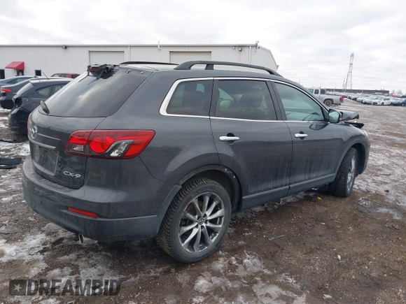 2015 Mazda CX-9 Grand Touring with VIN JM3TB2DAXF0447537, listed as a IAAI auction lot 41191694 with 157,113 mi miles. Bid and sale history available at carsss.com. Image 4.