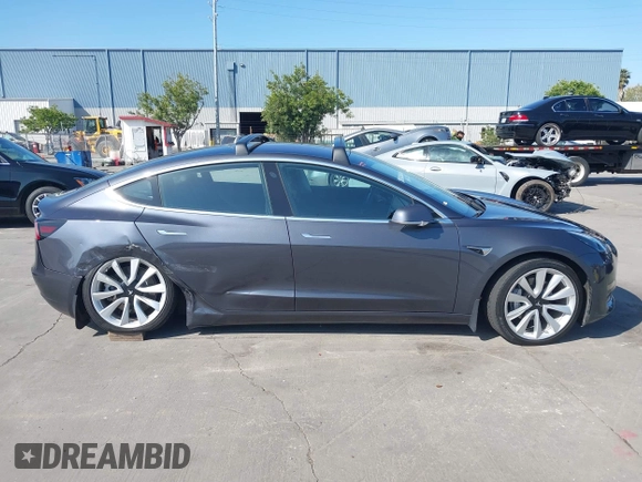 2018 Tesla Model 3 Long Range Battery with VIN 5YJ3E1EA4JF024102, listed as a IAAI auction lot 42100621 with 86,298 mi miles and . Bid and sale history available at DreamBid. Image 12.