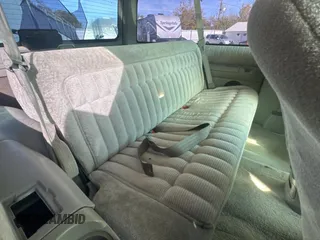 1993 GMC Yukon with VIN 1GKEK18K9PJ718702, listed as a Copart auction lot 82847154 with 103,848 mi miles and Clean Title. Bid and sale history available at carsss.com. Image 6.