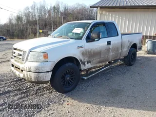 2005 Ford F-150 STX with VIN 1FTRX14W15NB34372, listed as a IAAI auction lot 41660412 with 104,086 mi miles. Bid and sale history available at carsss.com. Image 2.