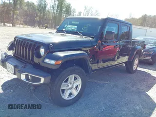 2023 Jeep Gladiator Sport S z VIN 1C6HJTAG8PL528821, wystawiony jako IAAI lot #41777653 z przebiegiem 65 656 mil mil oraz . Historia ofert i sprzedaży dostępna na DreamBid. Obrazek 2.