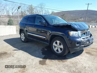2011 Jeep Grand Cherokee Laredo with VIN 1J4RR4GG3BC670712, listed as a IAAI auction lot 41738127 with 93,714 mi miles. Bid and sale history available at carsss.com. Image 1.
