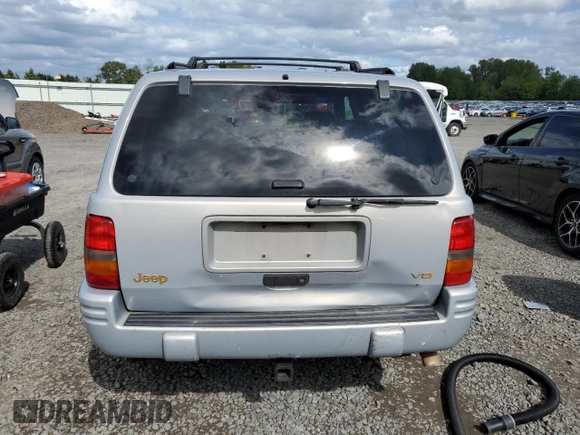 1998 Jeep Grand Cherokee Limited с VIN 1J4GZ78Y0WC245194, выставлен на аукционе Copart как лот 57838825 с пробегом 199 412 миль миль и Списание • Salvage title. История ставок и продаж доступна на DreamBid. Изображение 6.
