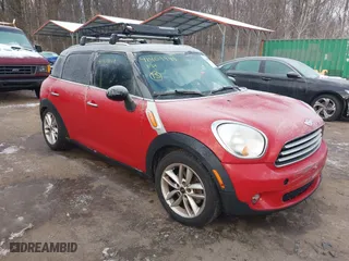 2013 MINI Cooper Countryman with VIN WMWZB3C59DWM31060, listed as a IAAI auction lot 41409949 with 145,806 mi miles. Bid and sale history available at carsss.com. Image 1.