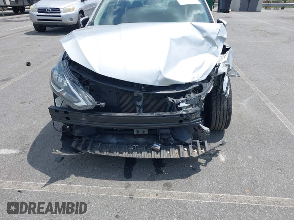 2019 Nissan Sentra S z VIN 3N1AB7AP6KY205658, wystawiony jako IAAI lot #42151392 z przebiegiem 80 395 mil mil oraz . Historia ofert i sprzedaży dostępna na DreamBid. Obrazek 6.