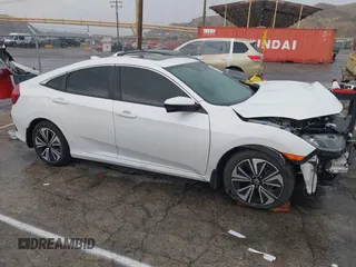 2020 Honda Civic EX-L with VIN 19XFC1F7XLE208720, listed as a IAAI auction lot 41725235 with 70,794 mi miles and . Bid and sale history available at DreamBid. Image 13.