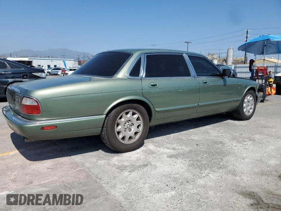 1999 Jaguar XJ with VIN SAJHX604XXC854217, listed as a Copart auction lot 56042735 with 127,092 mi miles and Salvage title. Bid and sale history available at DreamBid. Image 3.