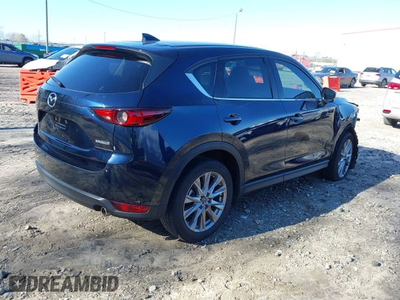 2021 Mazda CX-5 Grand Touring with VIN JM3KFADM5M0428279, listed as a IAAI auction lot 41747175 with 49,579 mi miles. Bid and sale history available at carsss.com. Image 4.