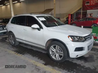 2013 Volkswagen Touareg Lux with VIN WVGEF9BP6DD007323, listed as a IAAI auction lot 41488959 with 123,383 mi miles and . Bid and sale history available at DreamBid. Image 1.
