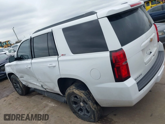 2017 Chevrolet Tahoe LT with VIN 1GNSKBKC1HR401044, listed as a IAAI auction lot 41573362 with 103,865 mi miles and . Bid and sale history available at DreamBid. Image 14.