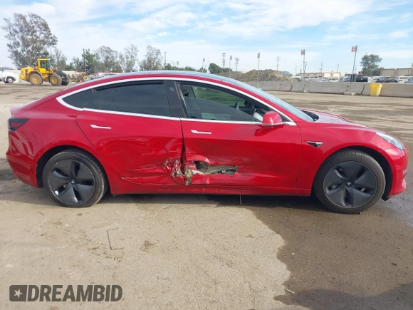 2020 Tesla Model 3 Standard Range Plus with VIN 5YJ3E1EA9LF718027, listed as a IAAI auction lot 41679320 with 68,987 mi miles. Bid and sale history available at carsss.com. Image 13.
