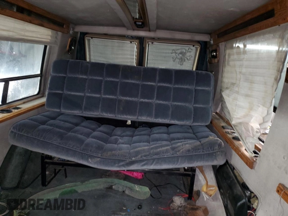 1995 Chevrolet Chevy Van z VIN 1GBEG25K2SF243949, wystawiony jako Copart lot #50422305 z przebiegiem 193 169 mil mil oraz Szkody całkowita. Historia ofert i sprzedaży dostępna na DreamBid. Obrazek 10.