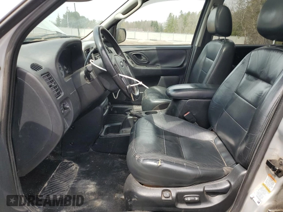 2003 Ford Escape Limited z VIN 1FMCU941X3KC33512, wystawiony jako Copart lot #51029495 z przebiegiem 146 616 mil mil oraz Szkoda całkowita • Salvage title. Historia ofert i sprzedaży dostępna na DreamBid. Obrazek 7.