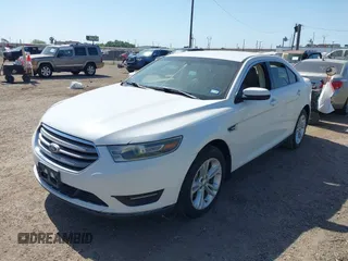 2015 Ford Taurus SEL z VIN 1FAHP2E8XFG196270, wystawiony jako IAAI lot #42007068 z przebiegiem 150 093 mil mil oraz . Historia ofert i sprzedaży dostępna na DreamBid. Obrazek 2.