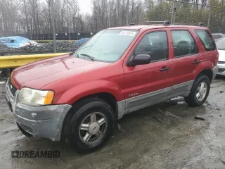2001 Ford Escape XLS with VIN 1FMYU02181KA64401, listed as a Copart auction lot 44216825 with 196,408 mi miles and Salvage Title. Bid and sale history available at carsss.com. Image 1.