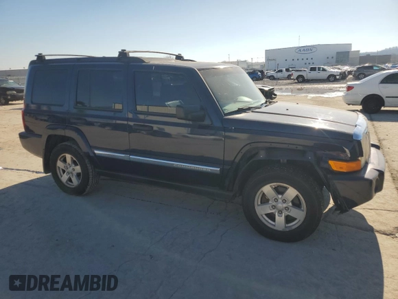 2006 Jeep Commander with VIN 1J8HH48K06C179567, listed as a Copart auction lot 88556105 with 196,696 mi miles and Salvage title. Bid and sale history available at DreamBid. Image 4.