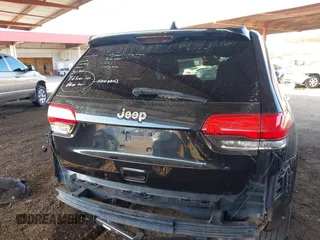 2014 Jeep Grand Cherokee Laredo with VIN 1C4RJEAG3EC472714, listed as a IAAI auction lot 40980100 with 124,603 mi miles. Bid and sale history available at carsss.com. Image 17.