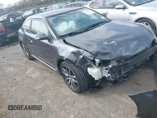2015 Scion tC z VIN JTKJF5C70FJ013710, wystawiony jako IAAI lot #41770647 z przebiegiem Nie podano mil oraz . Historia ofert i sprzedaży dostępna na DreamBid. Obrazek 1.