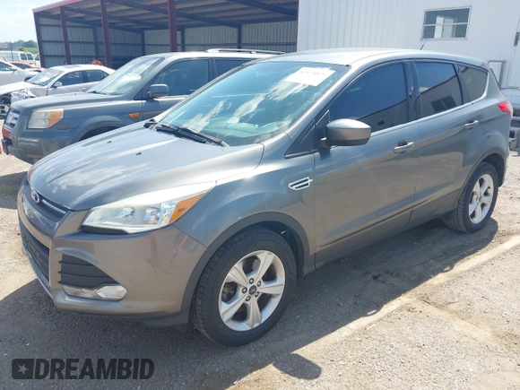 2014 Ford Escape SE with VIN 1FMCU9GX0EUE12195, listed as a IAAI auction lot 42674879 with 96,576 mi miles and . Bid and sale history available at DreamBid. Image 2.