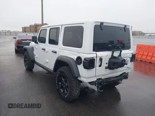 2023 Jeep Wrangler Sport with VIN 1C4HJXDN8PW523532, listed as a IAAI auction lot 41962483 with 14,643 mi miles and . Bid and sale history available at DreamBid. Image 3.