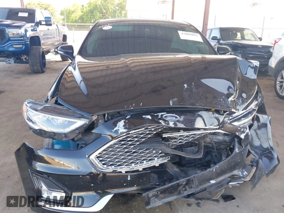 2020 Ford Fusion Titanium with VIN 3FA6P0RU8LR141324, listed as a IAAI auction lot 42004026 with 107,136 mi miles and . Bid and sale history available at DreamBid. Image 6.
