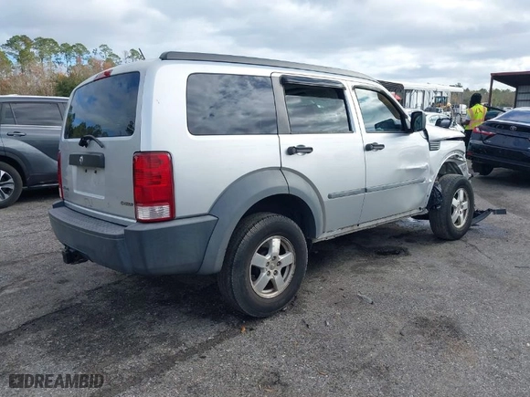 2007 Dodge Nitro SXT with VIN 1D8GT28K97W683073, listed as a IAAI auction lot 41123780 with 191,877 mi miles. Bid and sale history available at carsss.com. Image 4.