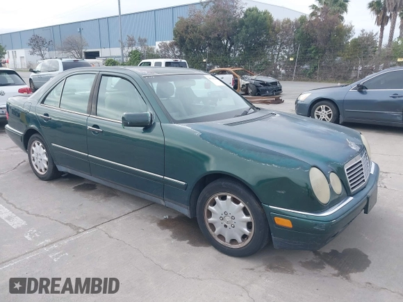 1997 Mercedes-Benz E-Class with VIN WDBJF55F3VJ034009, listed as a IAAI auction lot 41710225 with 239,673 mi miles. Bid and sale history available at carsss.com. Image 1.