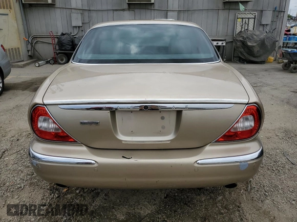 2004 Jaguar XJ with VIN SAJEA74C84SG03857, listed as a Copart auction lot 62156875 with 92,649 mi miles and Salvage title. Bid and sale history available at DreamBid. Image 6.