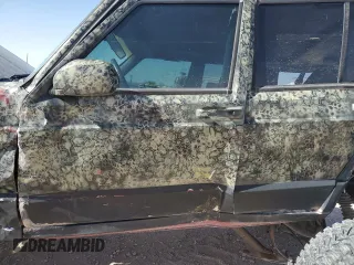1999 Jeep Cherokee Sport with VIN 1J4FF68S6XL645028, listed as a Copart auction lot 48897255 with 218,552 mi miles and Salvage Title. Bid and sale history available at carsss.com. Image 7.