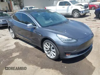 2020 Tesla Model 3 Standard Range Plus with VIN 5YJ3E1EAXLF615781, listed as a IAAI auction lot 42068935 with 96,026 mi miles. Bid and sale history available at carsss.com. Image 1.