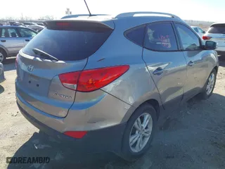 2013 Hyundai Tucson GLS with VIN KM8JU3ACXDU769618, listed as a IAAI auction lot 41758074 with 148,848 mi miles. Bid and sale history available at carsss.com. Image 4.