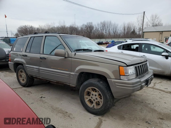 1997 Jeep Grand Cherokee Limited with VIN 1J4GZ78Y3VC568413, listed as a Copart auction lot 86171124 with 104,558 mi miles and Salvage Title. Bid and sale history available at carsss.com. Image 4.