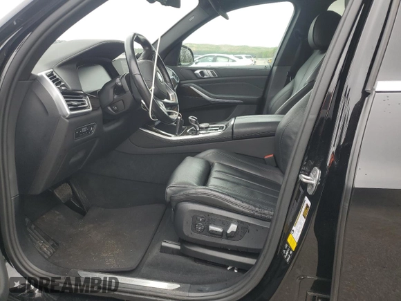 2020 BMW X5 xDrive40i with VIN 5UXCR6C09L9C95232, listed as a Copart auction lot 60697765 with 30,017 mi miles and Salvage title. Bid and sale history available at DreamBid. Image 7.