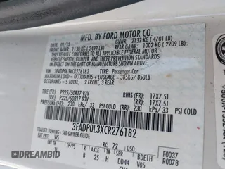 2012 Ford Fusion Hybrid z VIN 3FADP0L3XCR276182, wystawiony jako IAAI lot #42260450 z przebiegiem 133 567 mil mil oraz . Historia ofert i sprzedaży dostępna na DreamBid. Obrazek 9.