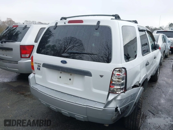 2007 Ford Escape XLT with VIN 1FMYU03197KB80133, listed as a IAAI auction lot 41084715 with 185,132 mi miles and . Bid and sale history available at DreamBid. Image 6.
