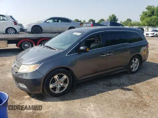 2012 Honda Odyssey Touring with VIN 5FNRL5H90CB505590, listed as a Copart auction lot 62566715 with 323,092 mi miles and Clean title. Bid and sale history available at DreamBid. Image 1.
