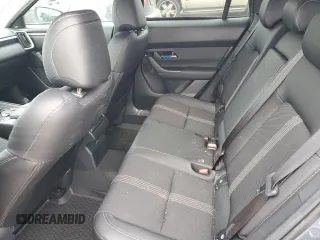 2025 Mazda CX-50 S Premium z VIN 7MMVABDM9SN322170, wystawiony jako Copart lot #85856354 z przebiegiem 1 774 mil mil oraz Czysty tytuł • Clean title. Historia ofert i sprzedaży dostępna na DreamBid. Obrazek 11.